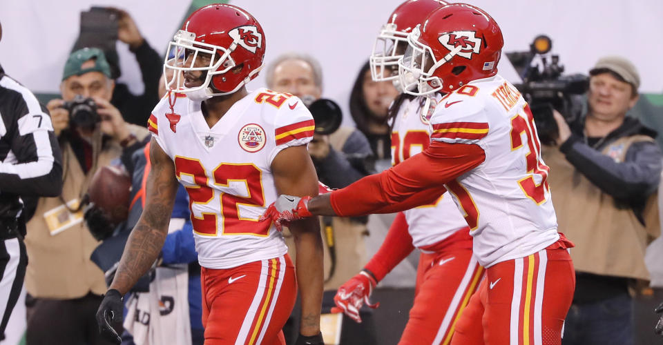 Teammates of Kansas City Chiefs' Marcus Peters, left, try to prevent him from leaving the field after a penalty during the second half of the team's game against the New York Jets on Sunday. (AP)