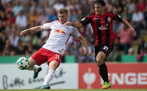 Leipzig's Timo Werner (L) is challenged by Dorfmerkingen's Felix Gruber during the German DFB Cup 1st round match - Credit: EPA