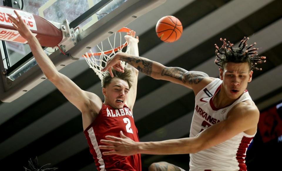 Mar 9, 2024; Tuscaloosa, Alabama, USA; Alabama forward Grant Nelson (2) blocks a shot in the lane by Arkansas forward Trevon Brazile (2) at Coleman Coliseum. Mandatory Credit: Gary Cosby Jr.-USA TODAY Sports