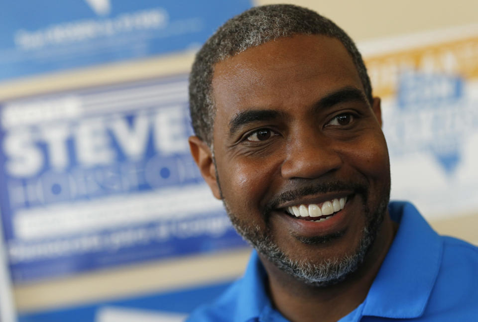 FILE - In this Nov. 6, 2018, file photo, Steven Horsford, Democratic candidate for Nevada's fourth congressional district, visits a Democratic office in Las Vegas. Horsford said in calling for U.S. Energy Secretary Rick Perry to "resign immediately" that the new disclosure is further evidence that Nevada has been covertly "coerced" into illegally receiving nuclear materials "through negligence or outright trickery." (AP Photo/John Locher, File)