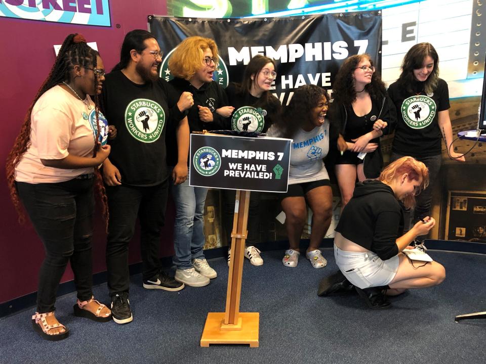 A group of fired Starbucks employees celebrate the result of a vote to unionize one of the coffee company's locations on Tuesday, June 7, 2022, in Memphis, Tenn. The so-called "Memphis Seven" jumped for joy, hugged each other and wept after a count held by the National Labor Relations Board showed an 11-3 vote in favor of unionization of a Starbucks in Memphis. Starbucks said they were fired for violating company policies, but the seven say they were let go in retaliation for unionization efforts. (AP Photo/Adrian Sainz)