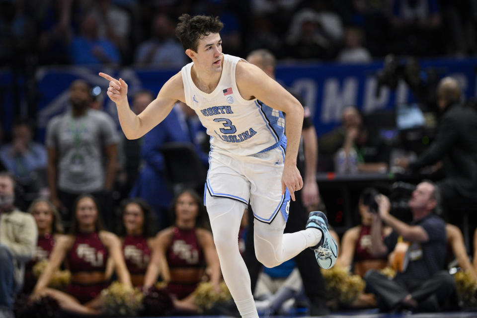 North Carolina guard Cormac Ryan celebrates his three-point basket during the first half of an NCAA college basketball game against Florida State in the quarterfinal round of the Atlantic Coast Conference tournament Thursday, March 14, 2024, in Washington. (AP Photo/Nick Wass)