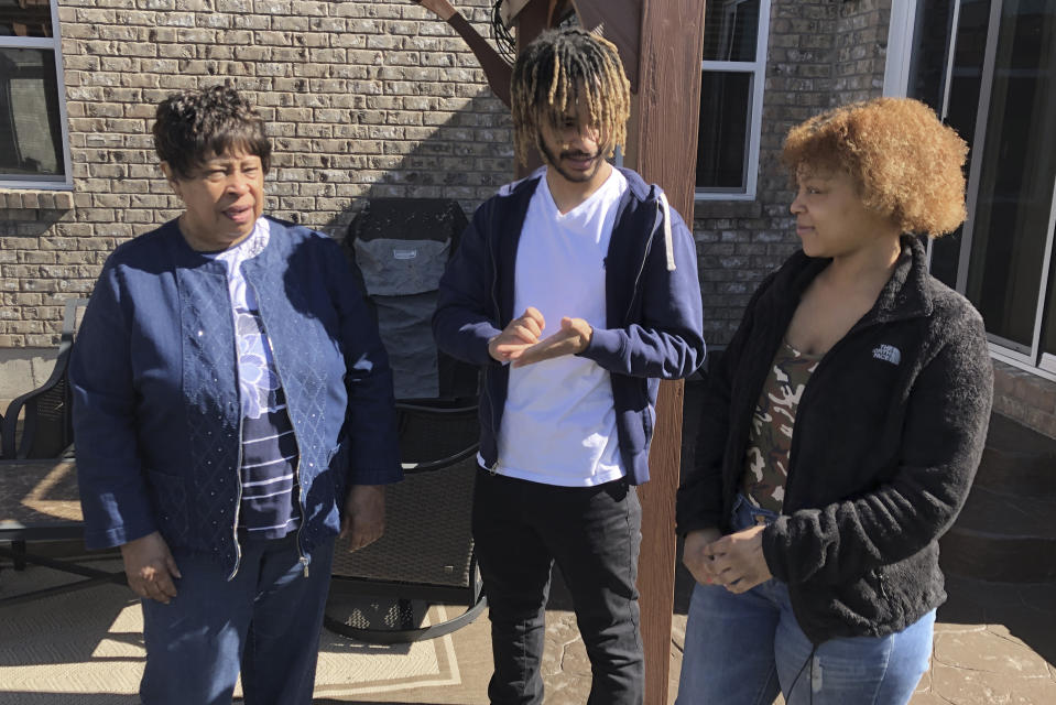 Doris Rolark, left, talks with her great-grandchildren, Tre Calhoun, 18, and Amaya Gates, right, 21, Sunday, March 7, 2021, in Monroe, Ohio. The pandemic and its isolating restrictions have been especially tough for many of the nation's some 70 million grandparents, many at ages when they are considered most vulnerable to the deadly COVID-19 virus. Rolark, of Middletown, Ohio, has always been active with the offspring. She raised three children mostly on her own, had five grandchildren (two now deceased), and has helped a lot with some of her 16 great-grandchildren. (AP Photo/Dan Sewell)