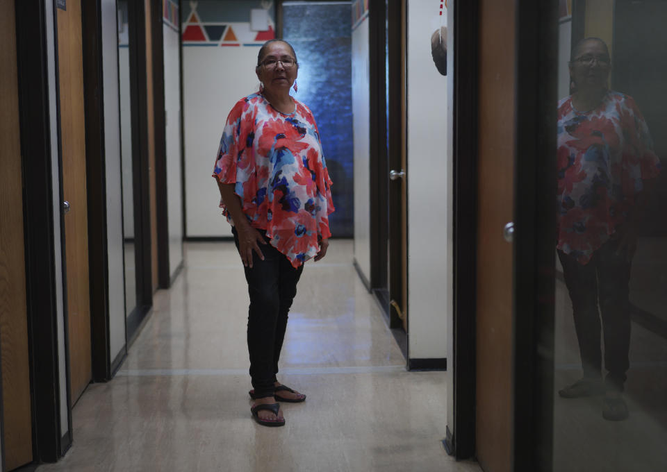 Flo Buffalo, a survivor of the Ermineskin residential school, stands for a portrait at the Montana First Nation band office on Tuesday, July 19, 2022, in Maskwacis, Alberta. To this day Buffalo refuses to drink milk due to the abuse she faced at the hands of nuns, who as she recalls, held her arms and forced sour milk into her mouth. Pope Francis will visit Maskwacis, where he's scheduled to make a sweeping apology for the abuses at a system designed to sever Native children from their tribal, family and religious bonds. (AP Photo/Jessie Wardarski)