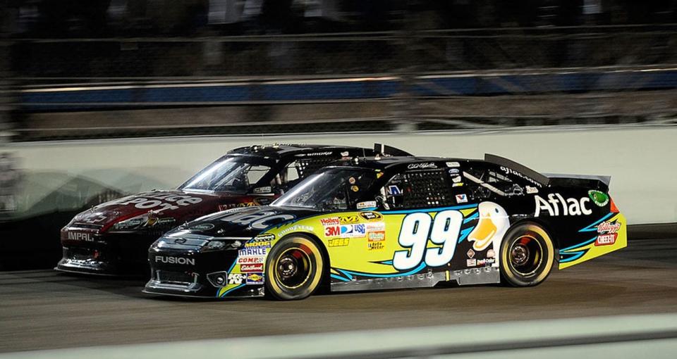 HOMESTEAD, FL - NOVEMBER 20: Tony Stewart, driver of the #14 Office Depot/Mobil 1 Chevrolet, races Carl Edwards, driver of the #99 Aflac Ford, during the NASCAR Sprint Cup Series Ford 400 at Homestead-Miami Speedway on November 20, 2011 in Homestead, Florida. (Photo by Jared C. Tilton/Getty Images)