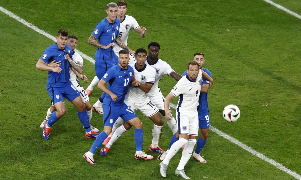 <span>Harry Kane (second right) keeps his eyes on a cross against Slovenia.</span><span>Photograph: Mohammed Badra/EPA</span>