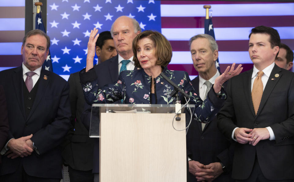 Speaker of the House Nancy Pelosi, D-Calif, center, speaks during a media conference after a meeting at NATO headquarters in Brussels, Monday, Feb. 17, 2020. Speaker of the House Nancy Pelosi is on a one day visit to Brussels to meet with leaders of the EU and NATO. (AP Photo/Virginia Mayo)