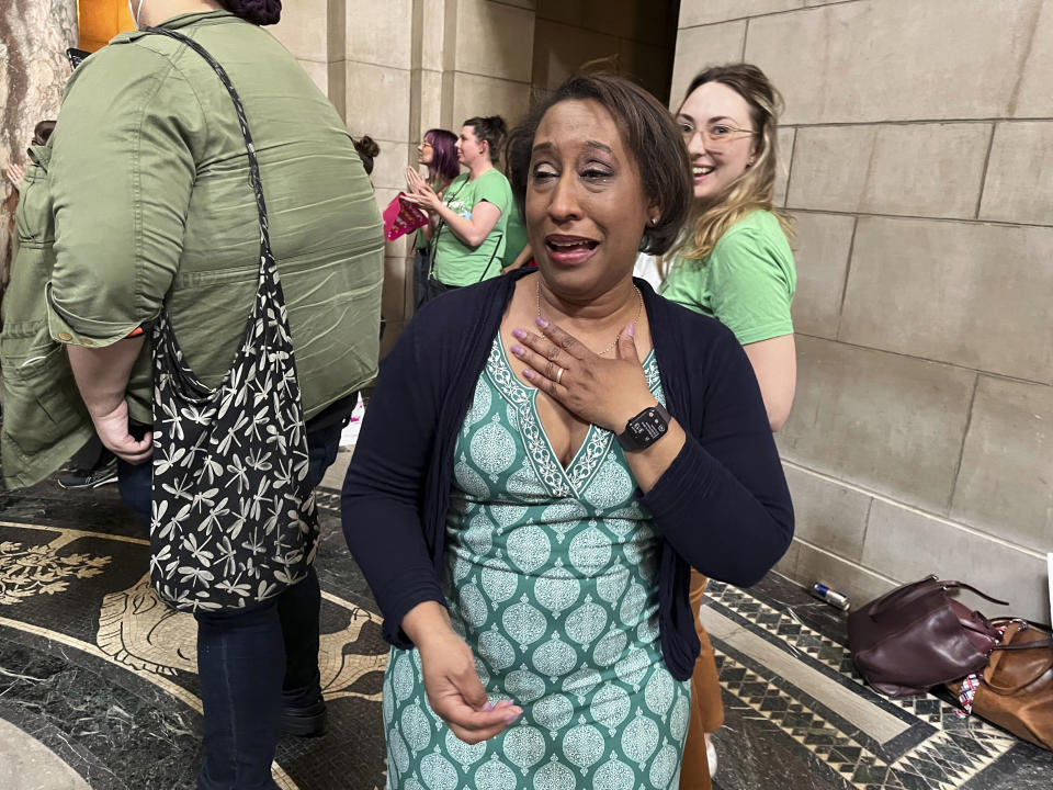 Jo Giles, executive director of the Women's Fund of Omaha, cries tears of joy inside the Nebraska State Capitol after the failure of a bill that would have banned abortion around the sixth week of pregnancy, Thursday, April 27, 2023 in Lincoln, Neb. The bill is now likely dead for the year, leaving in place a 2010 law that bans abortions at 20 weeks.(AP Photo/Margery Beck)