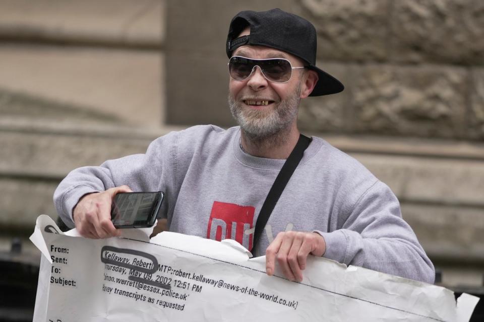 Former pop star Brian Harvey arrives at the High Court in London to protest (AP)