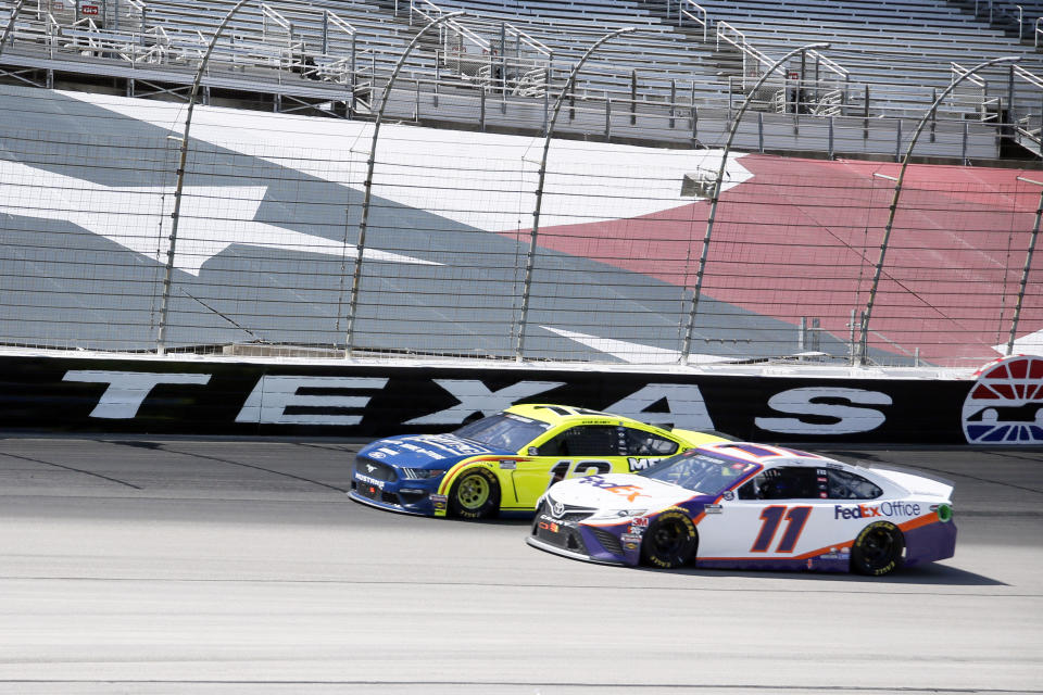 Ryan Blaney, left, and Denny Hamlin, right, do battle as they come out of Turn 4 during a NASCAR Cup Series auto race at Texas Motor Speedway in Fort Worth, Texas, Sunday, July 19, 2020. (AP Photo/Ray Carlin)