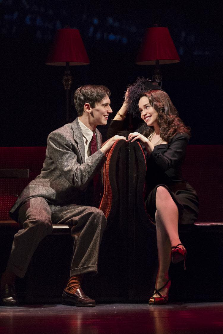 This theater image released by The O+M Company shows Cory Michael Smith, left, and Emilia Clarke in a scene from "Breakfast at Tiffany's," performing at the Cort Theatre in New York. (AP Photo/The O+M Company, Nathan Johnson Photography)