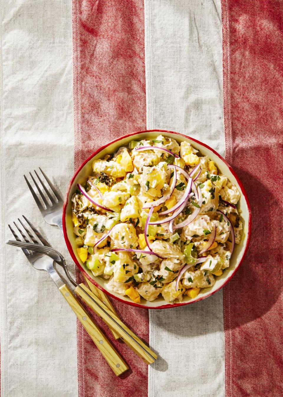 <p>We lightened up this 4th of July recipe with Greek yogurt instead of mayo, so feel free to double scoop.</p><p><em><a href="https://www.goodhousekeeping.com/food-recipes/a39275/parisian-potato-salad-recipe/" rel="nofollow noopener" target="_blank" data-ylk="slk:Get the recipe for Parisian Potato Salad »;elm:context_link;itc:0;sec:content-canvas" class="link ">Get the recipe for Parisian Potato Salad »</a></em></p>