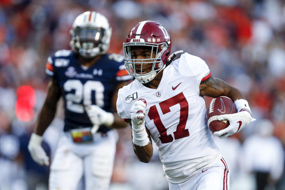 FILE - In this Saturday, Nov. 30, 2019 file photo, Alabama wide receiver Jaylen Waddle (17) carries the ball in for a touchdown after a reception in the first half of an NCAA college football game against Auburn in Auburn, Ala. The New York Giants spent the two months leading up to the draft in a somewhat unexpected dip into the free agency market that filled holes at wide receiver and cornerback, and narrowed their positional needs. (AP Photo/Butch Dill, File)