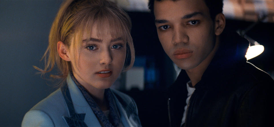 This image released by Warner Bros. Pictures shows Kathryn Newton, left, and Justice Smith in a scene from "Pokemon Detective Pikachu." (Warner Bros. Pictures via AP)