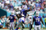 Miami Dolphins cornerback Xavien Howard (25) breaks up a pass intended for Buffalo Bills wide receiver Stefon Diggs (14) during the first half of an NFL football game, Sunday, Sept. 25, 2022, in Miami Gardens, Fla. (AP Photo/Wilfredo Lee )