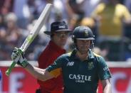 South Africa's AB de Villiers raises his bat to celebrate after 50 runs during their second One-Day International cricket match against England in Port Elizabeth, February 6, 2016. REUTERS/Mike Hutchings