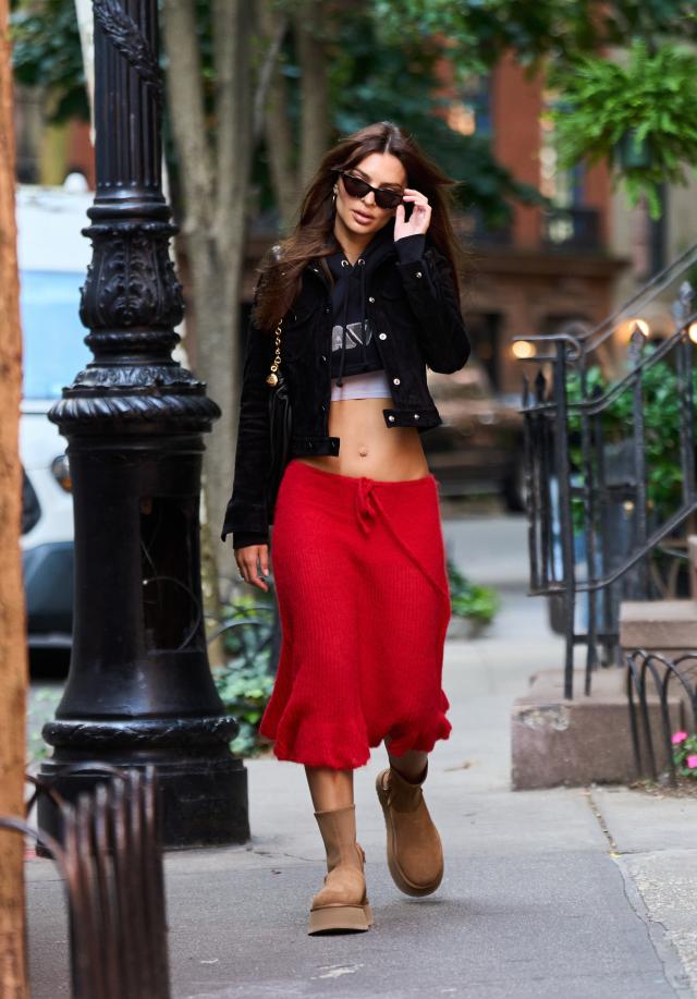 Emily Ratajkowski looks striking in a red skirt paired with a