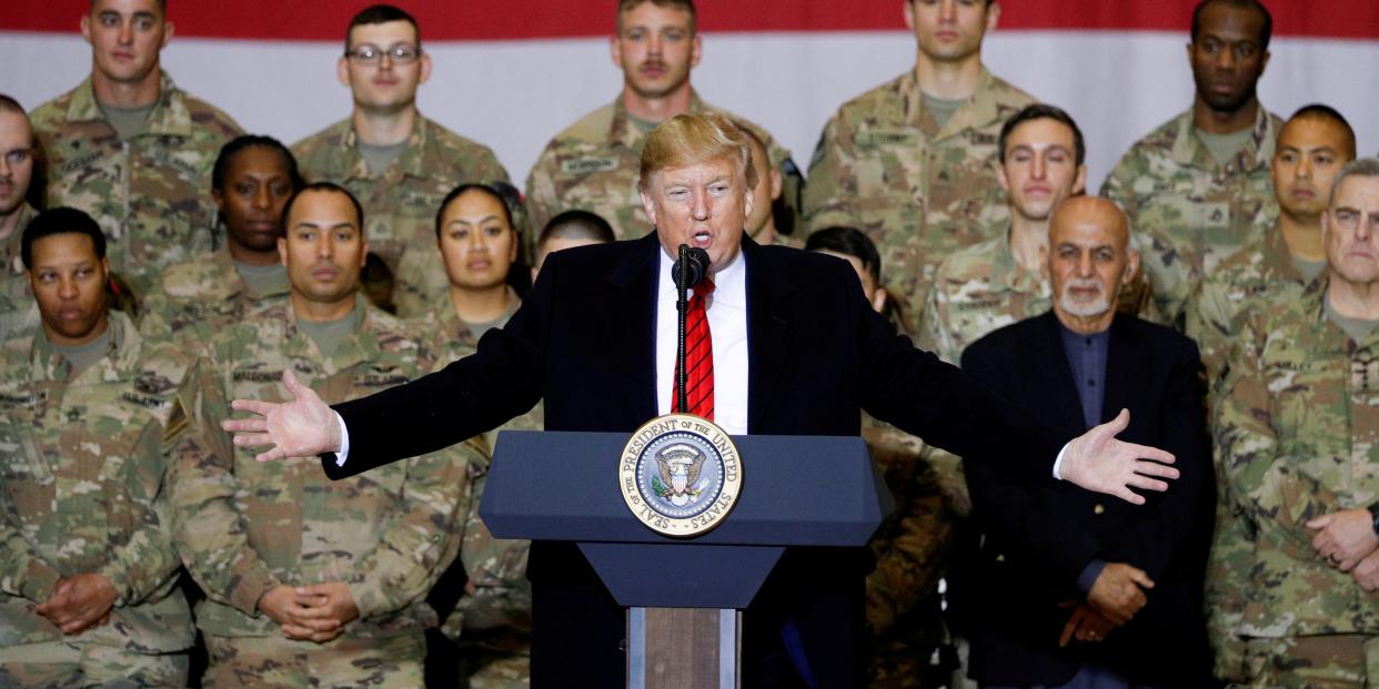 FILE PHOTO: U.S. President Donald Trump delivers remarks to U.S. troops, with Afghanistan President Ashraf Ghani standing behind him, during an unannounced visit to Bagram Air Base, Afghanistan, November 28, 2019. REUTERS/Tom Brenner