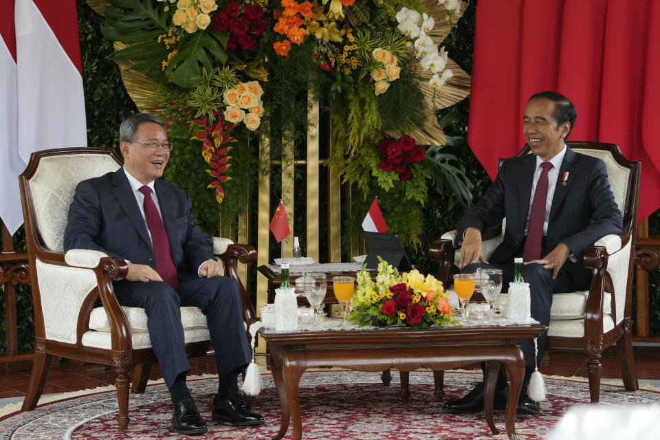 Chinese Premier Li Qiang, left, shares a light moment with Indonesian President Joko Widodo during their meeting at Merdeka Palace in Jakarta, Indonesia, Friday, Sept. 8, 2023. (AP Photo/Achmad Ibrahim)