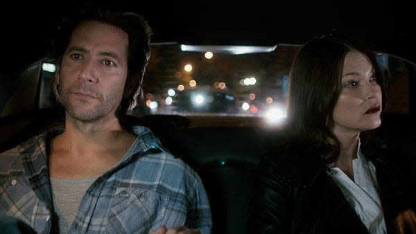 
A filmmaker (Henry Ian Cusick) and a femme fatale (Nicki Aycox) share a cab ride in “The Girl on the Train.”
