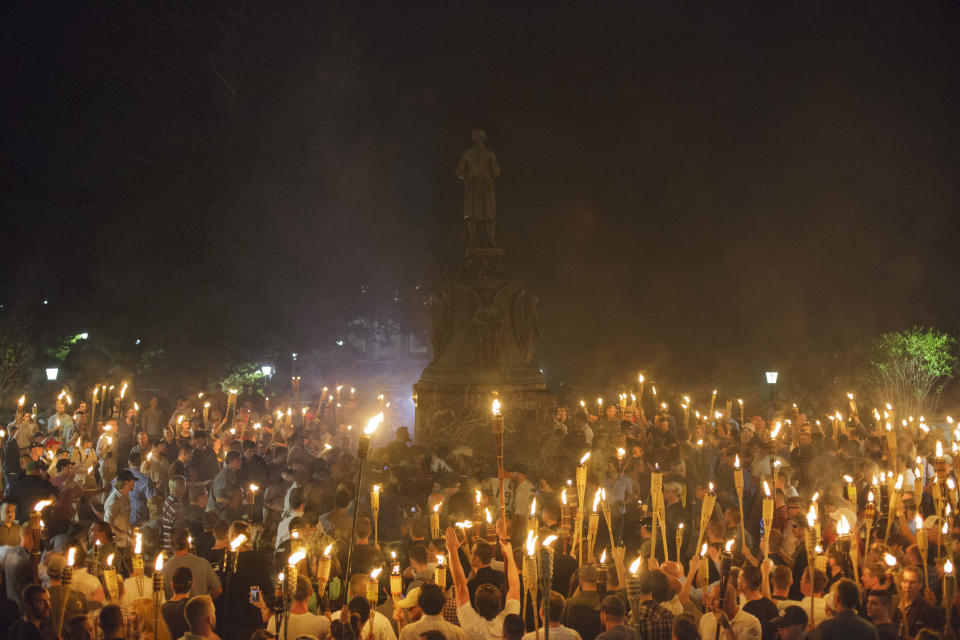 Neo Nazis, Alt-Right, and White Supremacists encircle counter protestors at the base of a statue of Thomas Jefferson after marching through the University of Virginia campus with torches in Charlottesville, Va., USA on August 11, 2017 (Photo: Shay Horse/NurPhoto via Getty Images)