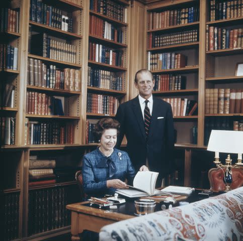 <p>Keystone/Hulton Archive/Getty</p> Queen Elizabeth and Prince Philip in the study at Balmoral Castle on September 26, 1976.