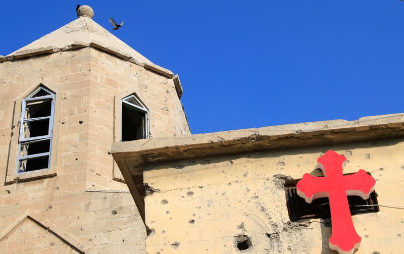 A cross is pictured at the wall of a church in the old city of Mosul