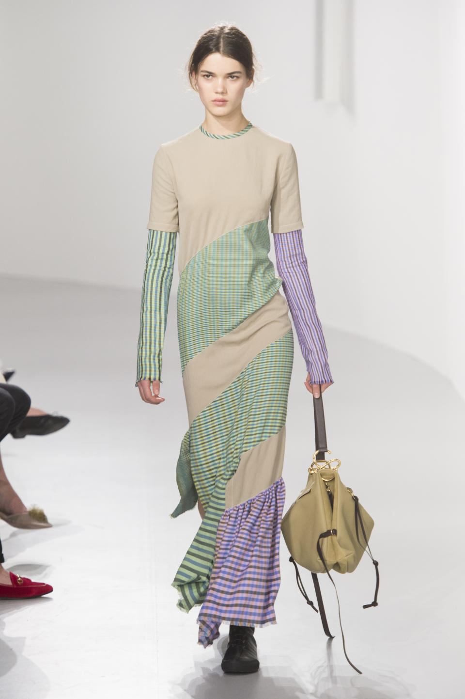 <p><i>Green, beige, and lavender striped maxi dress from the SS18 Loewe collection. (Photo: ImaxTree) </i></p>