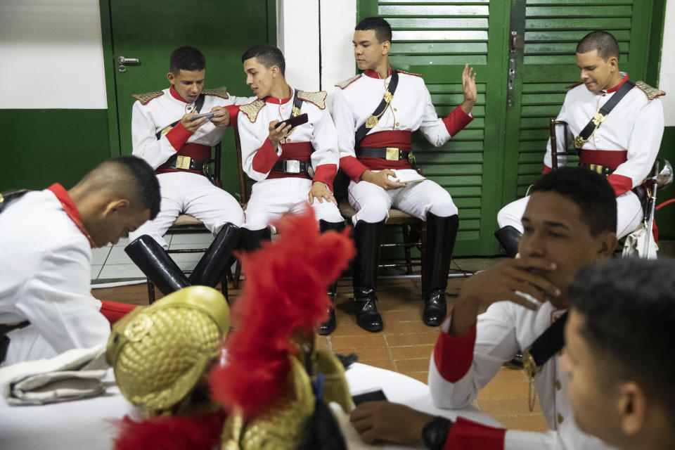 Bazilian honor guards wait for the welcoming ceremony during the BRICS emerging economies at the Itamaraty palace in Brasilia, Brazil, Thursday, Nov. 14, 2019. (AP Photo/Pavel Golovkin, Pool)