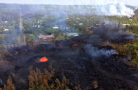 <p>In this handout photo provided by the U.S. Geological Survey, lava bubbles burst from a new fissure after the eruption of Hawaii’s Kilauea volcano on May 5, 2018 in the Leilani Estates subdivision near Pahoa, Hawaii. The governor of Hawaii has declared a local state of emergency near the Mount Kilauea volcano after it erupted following a 5.0-magnitude earthquake, forcing the evacuation of nearly 1,700 residents. (Photo from U.S. Geological Survey via Getty Images) </p>