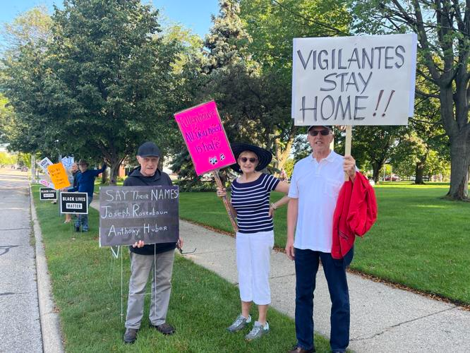 From left to right: Protestors Walter “Mac” Davis, Mary Harberts and John Scheid on Wednesday, July 19, in Grand Haven.