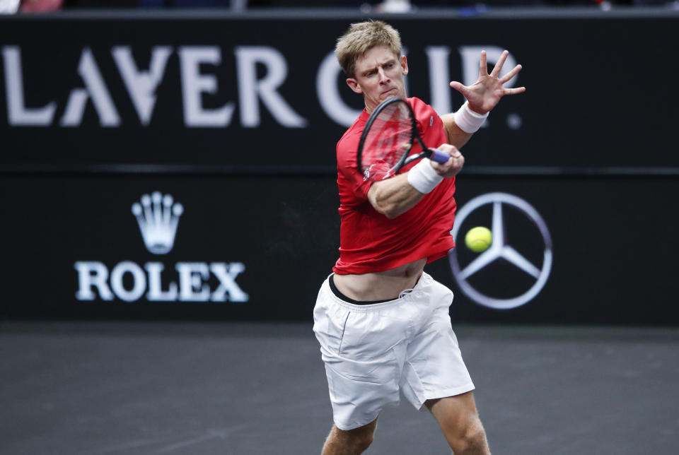 Team World's Kevin Anderson hits a return to Team Europe's Novak Djokovic at the Laver Cup tennis event, Saturday, Sept. 22, 2018, in Chicago. (AP Photo/Kamil Krzaczynski)