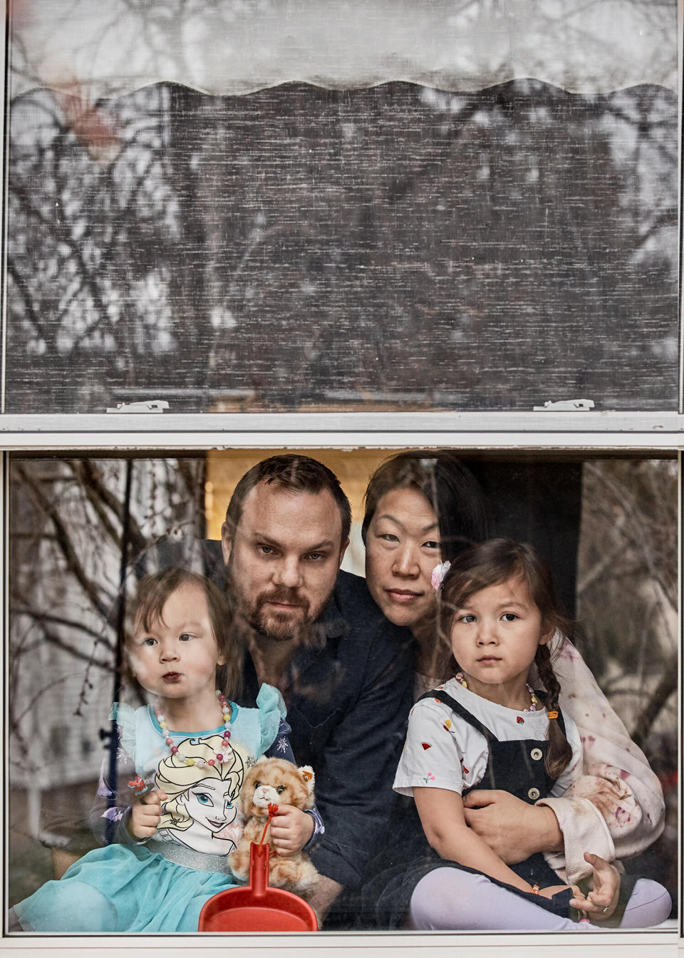 Michael Oliverio (left) and Barbara Kwon with their two daughters, ages 4 and 2. (Photo: Danielle St. Laurent)