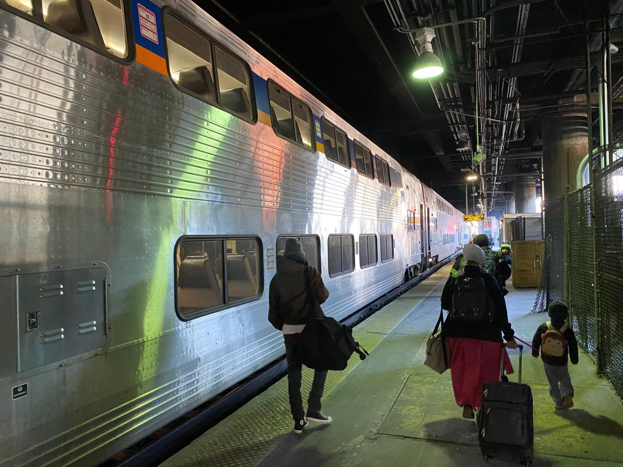 <p>A train waits on the platform in Washington DC. A little way up the platform, the Amtrak Capitol Limited waits to begin a 17-hour journey to Chicago. </p> (Richard Hall/The Indepedent)