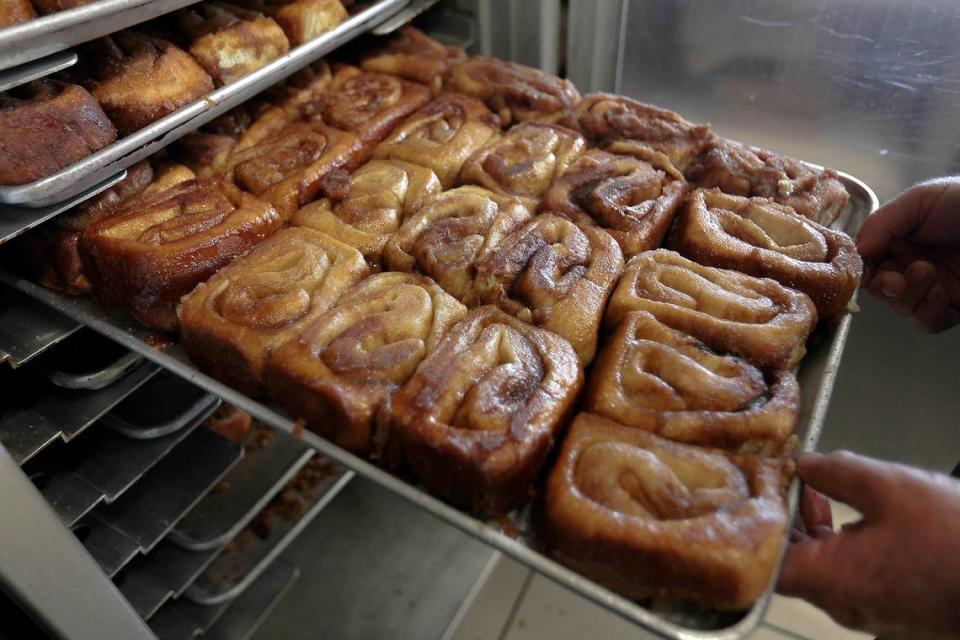 A fresh batch of cinnamon rolls comes out of the oven at Old West Cinnamon Rolls in Pismo Beach. 