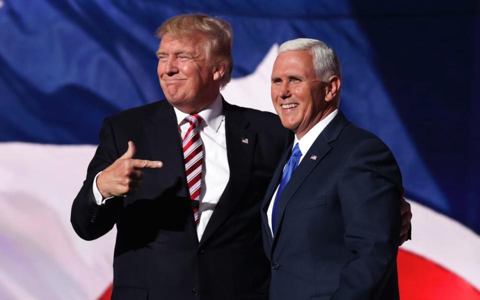 <div class="inline-image__caption"><p>Republican presidential candidate Donald Trump stands with Republican vice presidential candidate Mike Pence and acknowledge the crowd on the third day of the Republican National Convention on July 20, 2016 at the Quicken Loans Arena in Cleveland, Ohio. </p></div> <div class="inline-image__credit">Chip Somodevilla / Getty </div>
