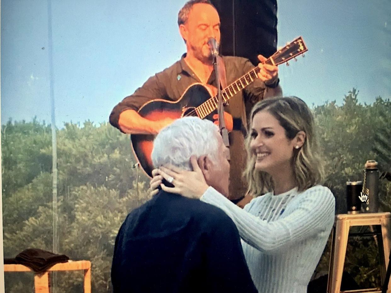 Bob Kraft and Dana Blumberg dance to Dave Matthews