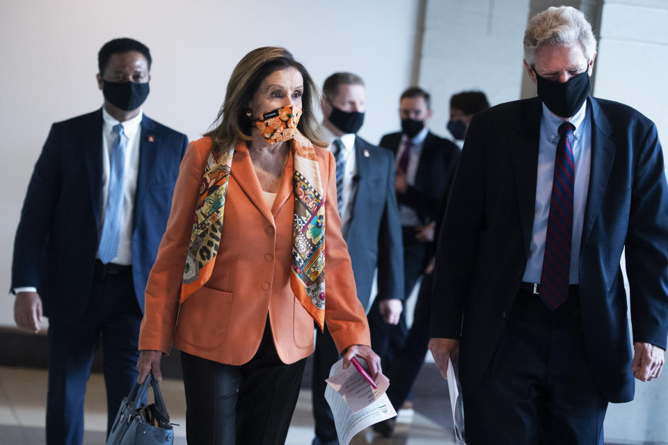 UNITED STATES - OCTOBER 08: Speaker of the House Nancy Pelosi, D-Calif., and Rep. Frank Pallone, D-N.J., arrive for her weekly news conference in the Capitol Visitor Center on Thursday, October 08, 2020. (Photo By Tom Williams/CQ-Roll Call, Inc via Getty Images)