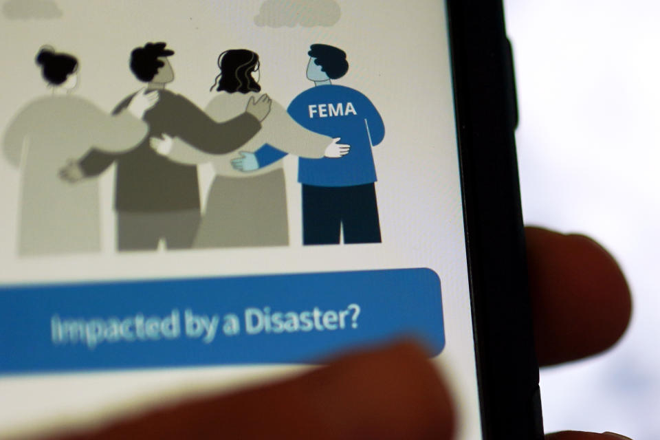 A phone displays the Federal Emergency Management Agency application Wednesday, June 29, 2022, in San Diego. FEMA is releasing the largest update to its mobile application in a decade, at the beginning of a hurricane season that experts predict will be above average and a wildfire season that's on par with recent years' big burns. (AP Photo/Gregory Bull)