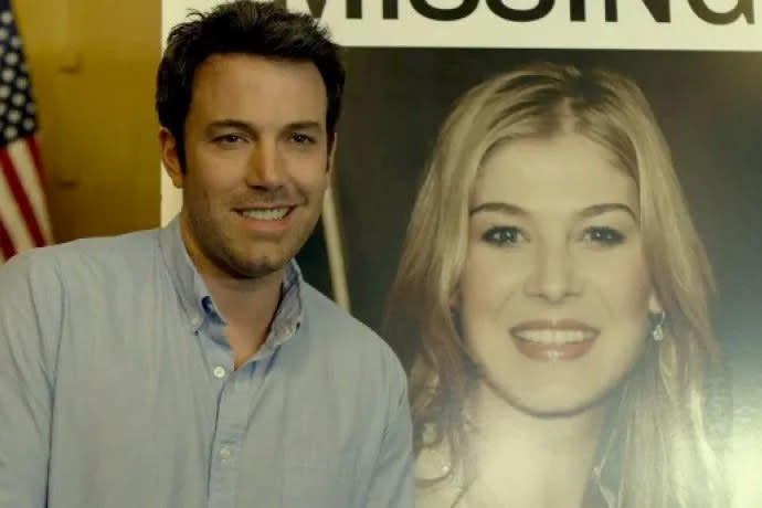 Nick smiling next to the "Missing" poster