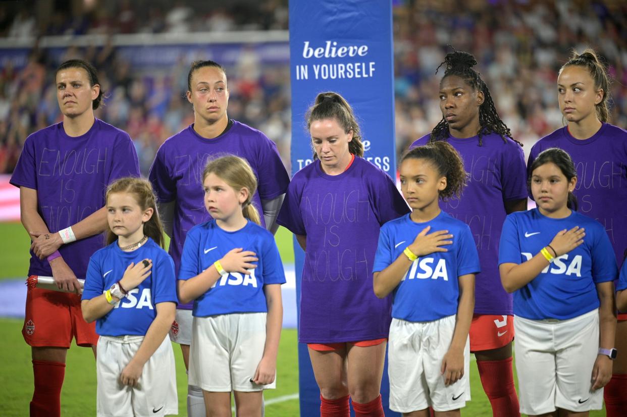 Canada women's soccer players wear "Enough is Enough" shirts in protest of their federation.