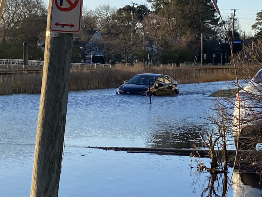 Driver going through high tide in Norfolk’s Colonial Place neighborhood on Feb. 7, 2024. (WAVY photo)