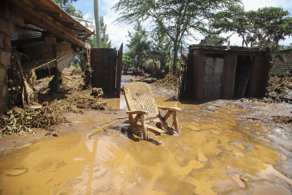 A chair stuck in the muddy water after a dam burst, in Kamuchiri Village, Mai Mahiu, Nakuru County, Kenya, Monday, April 29, 2024. Police in Kenya say at least 40 people have died after a dam collapsed in the country's west. (AP Photo/Patrick Ngugi)