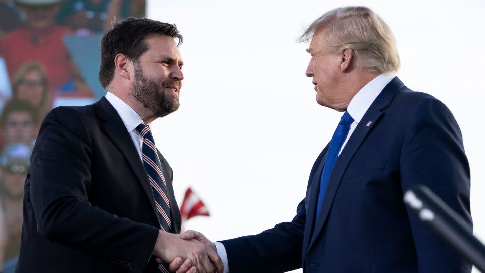 In this April 2022 photo, J.D. Vance shakes hands with former President Donald Trump during a rally hosted by the former president at the Delaware County Fairgrounds on in Delaware, Ohio. - Drew Angerer/Getty Images