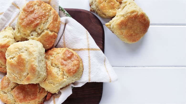 Buttery golden biscuits on cloth napkin 