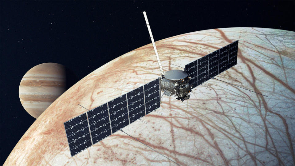 An artist's impression of NASA's Europa Clipper spacecraft making a close flyby of Jupiter's moon Europa. Equipped with state-of-the-art instrument, the probe will attempt to determine if a vast sub-surface ocean below Europa's ice crust might provide a habitable environment for life. / Credit: NASA