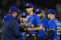 Seattle Mariners manager Scott Servais arrives to remove starting pitcher George Kirby during the seventh inning of the team's baseball game against the Boston Red Sox, Friday, March 29, 2024, in Seattle. (AP Photo/Lindsey Wasson)