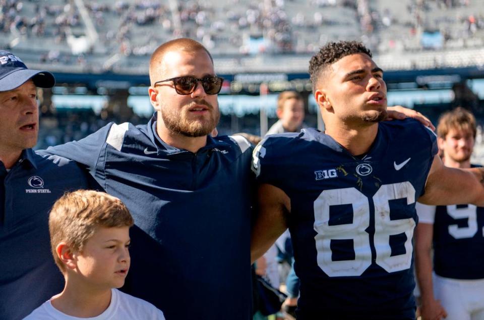 Former Penn State player and current Pittsburgh Steeler Pat Freiermuth sings the Penn State alma mater with tight end Brenton Strange and the team after the win over Central Michigan on Saturday, Sept. 24, 2022.