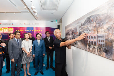 Guests receive a guided tour Monday of Sands China’s art exhibition, ‘Echoes of a Golden Age: Macro Events through the Micro Visions of Macao’s Legendary Contemporary Artists.’ The free-admission exhibition is open for public viewing 11 a.m.-7 p.m. daily until Jan. 5 at Sands Gallery, on the 6th floor of The Grand Suites at Four Seasons.