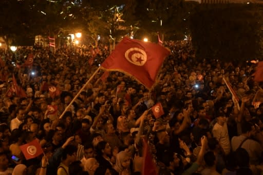 Thousands of people took to the streets of the capital Tunis to celebrate Saied's victory, honking horns and singing the national anthem
